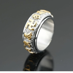 Spinner stainless steel ring with golden relief Buddhist mantras and swastika pattern
