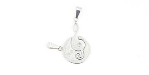 Macro view of silver musical note pendant with sparkling zircon stones and round disk