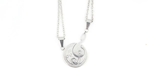 Detailed silver treble clef necklace with crystal accents and engraved love coin pendant