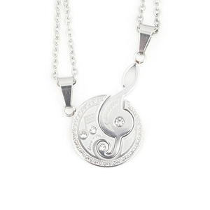 Polished stainless steel puzzle necklace for couples with music note and crystal accents