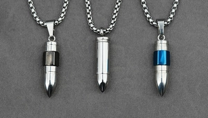 Detailed shot of bullet-shaped urn necklaces in silver, black, and blue finishes