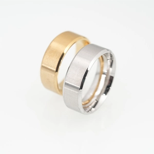 Minimalist brushed titanium steel rings in gold and silver with polished bevel edges