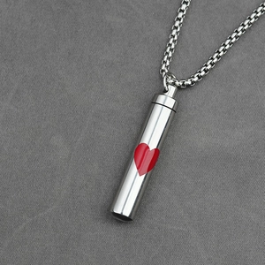 Silver stainless steel cylinder cremation necklace with a red heart on a box chain