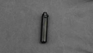 Close-up of a cylinder titanium steel perfume pendant with a secure hanging loop