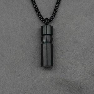Minimalist black stainless steel cylinder pendant with a brushed finish on a matching chain