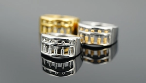 Macro shot of abacus rings with movable beads in gold and silver stainless steel finish