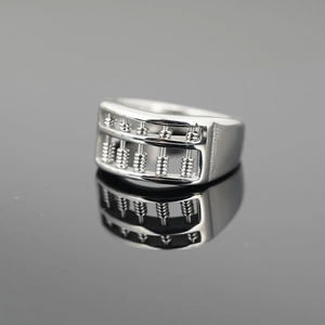 Polished silver abacus ring made of stainless steel with rotatable beads on black mirror