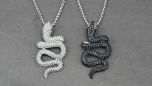 Detail view of two rattlesnake pendants in silver and black finishes with full crystal inlay