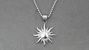 Close-up of vintage sun totem pendant in silver finish on a premium box chain