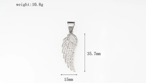 Detailed view of silver wing pendant with white crystals measuring 35.7mm in height
