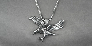 Detailed macro view of flying eagle pendant with S.Steel engraving and vintage texture
