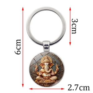 Porte-clés avec pendentif Ganesha en métal argenté et dimensions de 6cm et 3cm