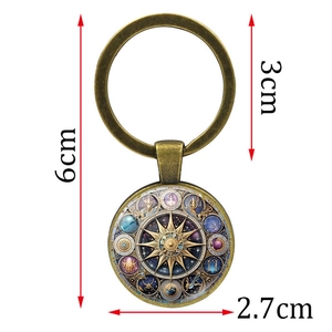 Vintage bronze sun and moon astrolabe keychain with detailed dimensions 6x3cm
