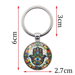 Hamsa Hand and Evil Eye keychain in silver metal with size measurements and colorful charm
