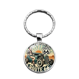 Close-up of vintage Route 66 keychain with classic car and retro American desert design