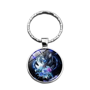 Classic silver metal keychain with circular fantasy dragon and rose pendant design