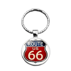 Close-up of classic Route 66 keychain with red blue white shield design and metal ring