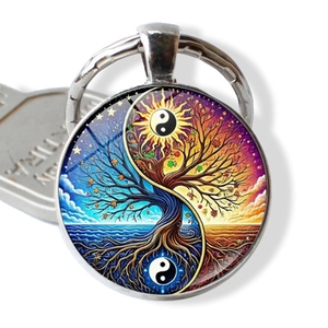 Detail of Tree of Life and Yin Yang design on a colorful round glass keychain charm