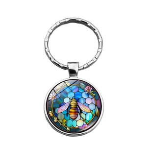 Creative metal keychain featuring a realistic bee and floral pattern in a colorful art style