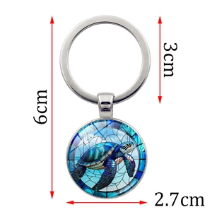 Turtle art keychain with silver metal ring and circular glass pendant, 6cm total length