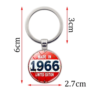 Vintage 1966 Limited Edition round metal keychain for bags and car keys with white background