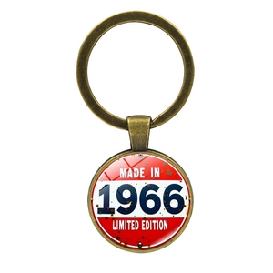Vintage 1966 limited edition metal keychain with bronze finish and retro round pendant