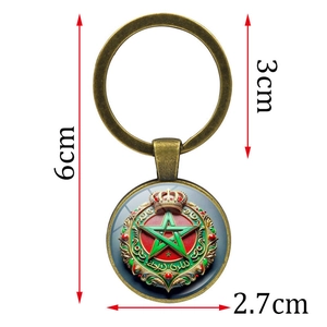 Moroccan emblem keychain in vintage bronze finish with glass cabochon pendant charm