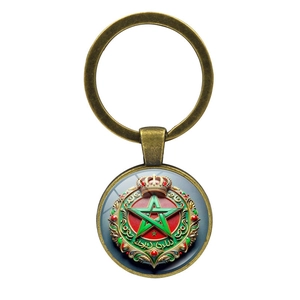 Vintage bronze Morocco coat of arms keychain with green pentagram and crown design