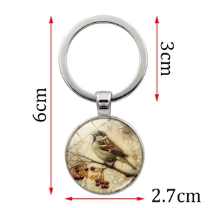 Bird on cherry tree branch vintage keychain with dimension measurements of 6cm length