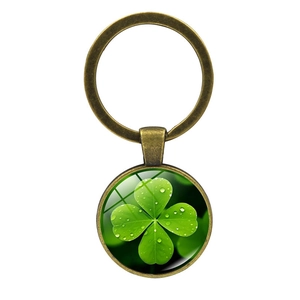 Vintage lucky four-leaf clover keychain with brass ring and green glass pendant charm