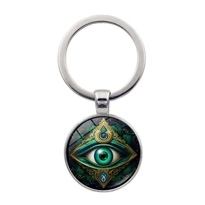 Macro detail of Hamsa Evil Eye keychain featuring a green glass dome with golden mystic symbols
