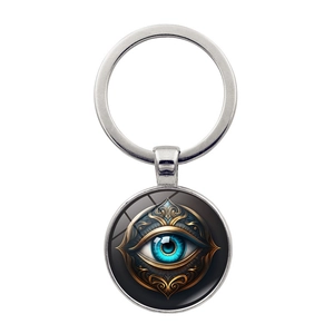 Macro shot of Hamsa Evil Eye keychain with blue eye motif and intricate gold details