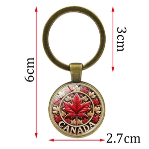 Vintage bronze Canada maple leaf keychain with dimensions showing 6cm length and 3cm ring