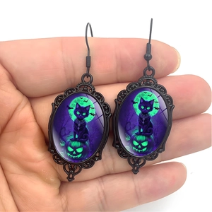 Gothic black cat oval dangle earrings for Halloween featuring purple moon and pumpkin