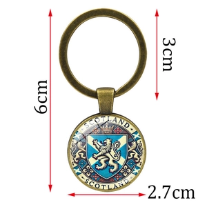 Vintage bronze Scotland crest keychain with lion emblem on white background