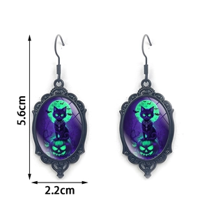 Gothic black cat and green pumpkin earrings with dimensions 5.6cm by 2.2cm
