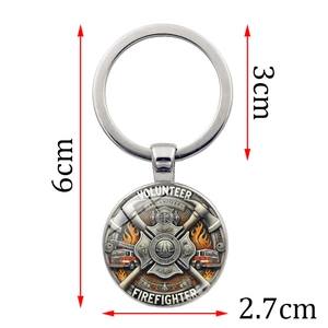 Volunteer firefighter keychain with axe and fire truck emblem, silver metal finish, 6cm long