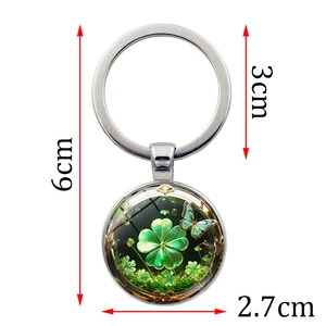 Green lucky clover and butterfly art glass keychain with dimensions on white background