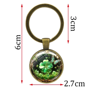 Antique bronze keychain with green four-leaf clover and butterfly pendant 6cm total length