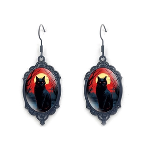 Gothic black cat oval pendant earrings featuring a mystical red moon and dark forest design