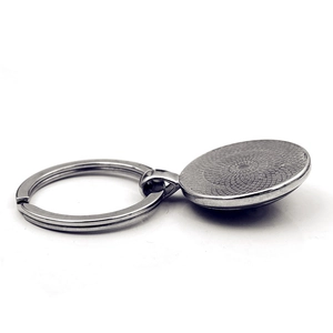 Polished silver metal heart-themed keychain featuring a round pendant base and flat split ring