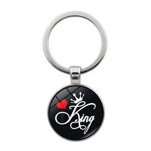 Silver metal King crown keyring with black circular pendant and red heart detail