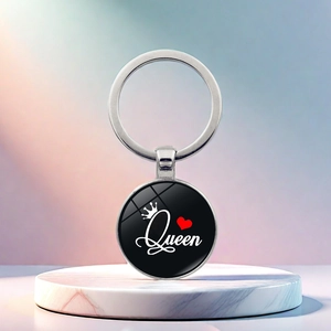 Polished silver metal King and Queen keychain featuring a black Queen pendant with a crown