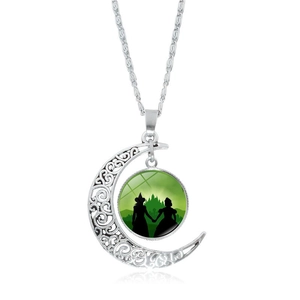 Silver crescent moon necklace featuring Wicked silhouette pendant on white background