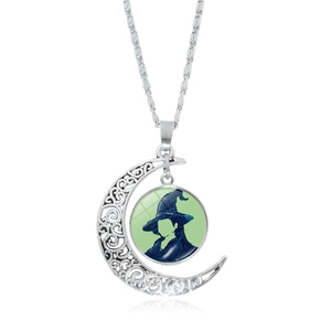 Silver crescent moon necklace with wizard silhouette glass pendant and hollow metal patterns