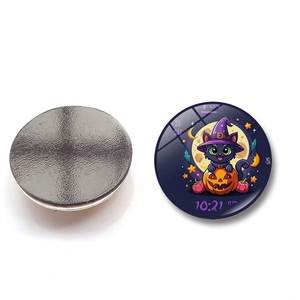 Close-up of circular Halloween magnet showing glass front with black cat and magnetic back