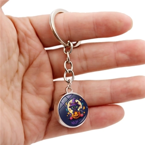 Halloween keychain with cartoon black cat and pumpkin pendant in glass dome