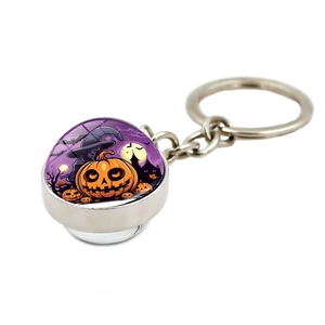 Close-up of Halloween keychain showing pumpkin and witch hat crystal ball pendant