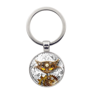 Portachiavi gatto steampunk con elementi meccanici in metallo e pendente in vetro