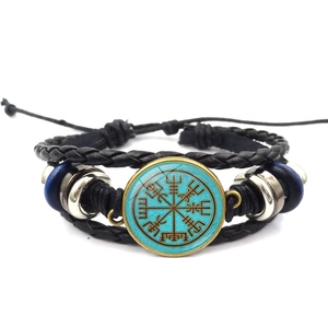 Close-up of Viking compass multi-layer braided leather bracelet with adjustable knot cord